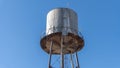 Blue tower with sky background. Water tank with blue sky. Royalty Free Stock Photo