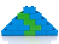Blue toy block pyramid with green toy blocks inside Royalty Free Stock Photo