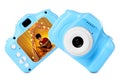 Blue toy cameras on white background in collage, one with photo of boy book Royalty Free Stock Photo