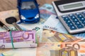 Blue toy car with euro banknotes, calculator Royalty Free Stock Photo