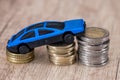 blue toy car with euro coin Royalty Free Stock Photo