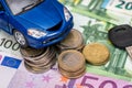 Blue toy car with key, euro bills Royalty Free Stock Photo