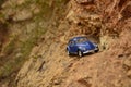 Blue toy car on mountain. Royalty Free Stock Photo