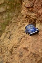 Blue toy car on mountain. Royalty Free Stock Photo