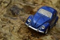 Blue toy car on mountain. Royalty Free Stock Photo