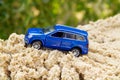 Blue toy car rises up Royalty Free Stock Photo