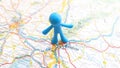 A blue toy man pin stuck in Bratislava on a map of Slovakia