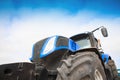 Tractor close-up against the sky