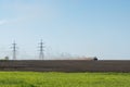 Blue tractor plowing field Royalty Free Stock Photo