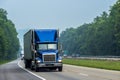 Blue Tractor-Trailer Rig Cruises An Interstate Highway Royalty Free Stock Photo
