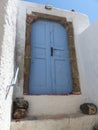 Blue traditional door to Santorini in the cyclades islands in Greece. Royalty Free Stock Photo