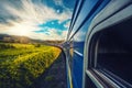 Blue train moving in a picturesque summer landscape Royalty Free Stock Photo