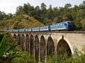 Blue train on Nine Arches bridge to Ella, Central Highlands, Sri Lanka Royalty Free Stock Photo