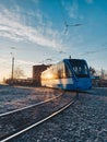 Blue tram on the tramlines on winter sunrise Royalty Free Stock Photo