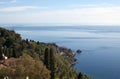 Blue tranquil sea over blue sky on sunny day. Scenic aerial panoramic landscape view near Taormina, Sicily Royalty Free Stock Photo