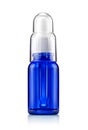 Blue transparent glass dropper cosmetic serum bottle Royalty Free Stock Photo