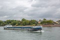 Blue transport ship on the river rhine passing the city of Neuwied