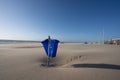 Blue trash cans dustbin on an empty beach Royalty Free Stock Photo