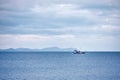 Trawler fishing boat sailing over the calm sea Royalty Free Stock Photo