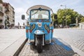 Blue tricycle waiting for tourist on the street of Porto, Portugal