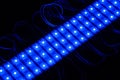 Blue triple segment led modules on black background Royalty Free Stock Photo