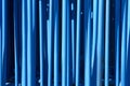 Blue tubular metallic background. Industrial abstract material