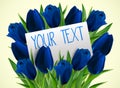 Blue tulip flowers with paper card