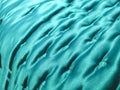 Blue turquoise satin bedspread background