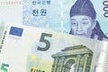 A blue won note from South Korea with a euro note from the European Union eurozone