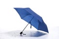 blue umbrella open on white floor in front of white studio background