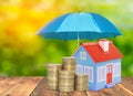 Umbrella protection House coins savings a business. Protection money insurance home concept