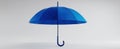 The blue umbrella standing elegantly against a minimalist background.AI generated image Royalty Free Stock Photo