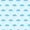 Blue umbrellas seamless background pattern vector illustration. Royalty Free Stock Photo