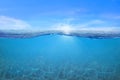 BLUE UNDER WATER waves and bubbles. Beautiful white clouds on blue sky over calm sea with sunlight reflection, Tranquil sea Royalty Free Stock Photo