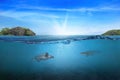 BLUE UNDER WATER waves and bubbles. Beautiful white clouds on blue sky over calm sea with sunlight reflection, Tranquil sea Royalty Free Stock Photo