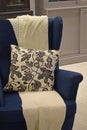 A blue upholstered chair.