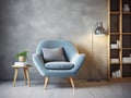 Blue upholstered snuggle chair and stack of books near it. Interior design of modern Scandinavian living room with stucco wall Royalty Free Stock Photo