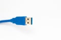 Blue usb cable on a white background Royalty Free Stock Photo