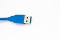 Blue usb cable on a white background Royalty Free Stock Photo
