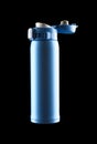 Blue vacuum tumbler with the cap opened on black background including clipping path