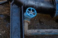 Blue valve close-up on the drain tube in the well Royalty Free Stock Photo