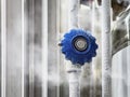 A close-up of a blue valve with nitrogen frost, indicating low temperatures in industrial conditions Royalty Free Stock Photo