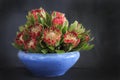 Blue vase with protea flowers