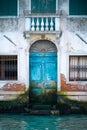 A blue Venician canalside door Royalty Free Stock Photo