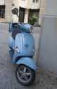 A blue Vespa motorcycle Royalty Free Stock Photo