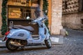 Blue Vespa On Cobblestones in Rome, Italy