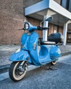 Blue vespa scooter parking in the city