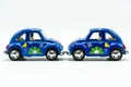 Blue vintage car with colorful flowers paint Royalty Free Stock Photo
