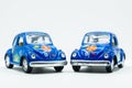 Blue vintage car with colorful flowers on white Royalty Free Stock Photo