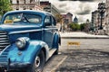 Blue vintage classic car parked in Old Havana street